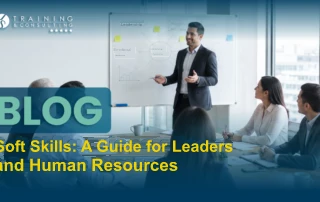 A presenter explains emotional intelligence and leadership to their team using a whiteboard.