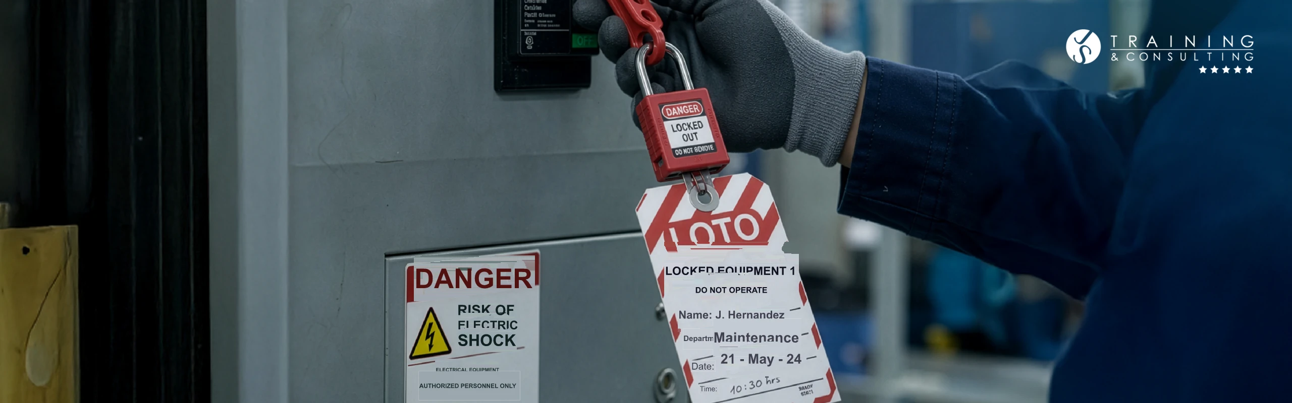 Detailed close-up of a hand wearing an industrial protective glove, placing a red safety padlock with a tag bearing operator “J. Hernández”'s information on a control panel with warning signs.