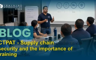 An instructor giving a presentation in front of a screen showing a risk and supplier assessment diagram.